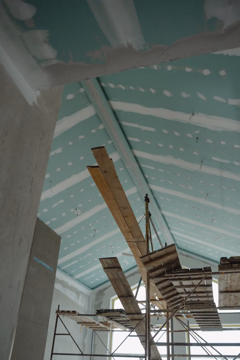 Debris removal crew hauling lumber and drywall from a Vista renovation project
