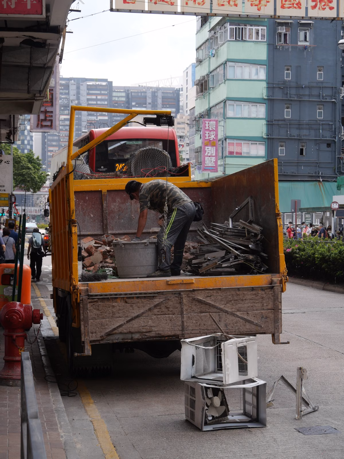 So Cal Junk Removal and Demo crew loading unwanted items into a truck in Downtown Vista